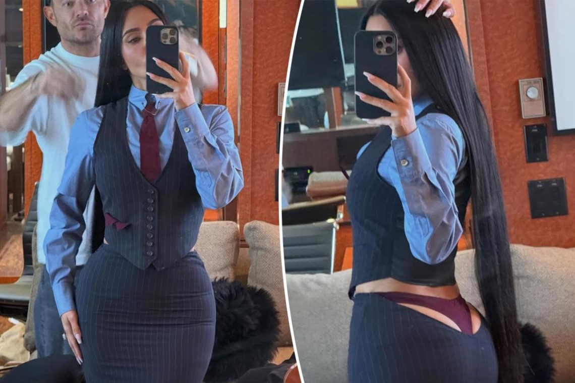 Kim Kardashian’s plunging ‘All’s Fair’ skirt suit lets her thong play peekaboo