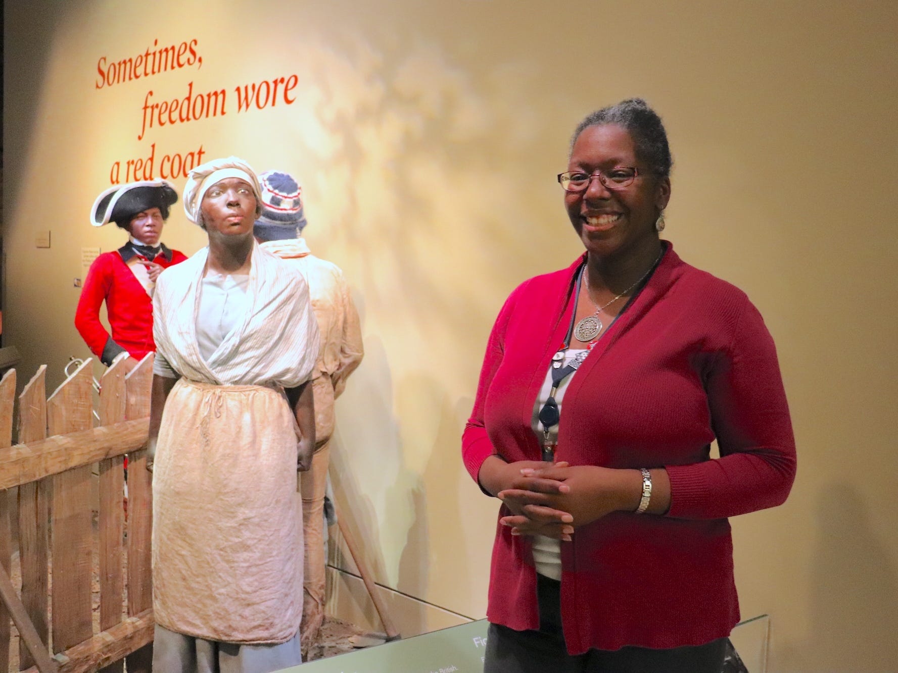 Adrienne Whaley with the mannequin she modeled for at the Museum of the American Revolution.