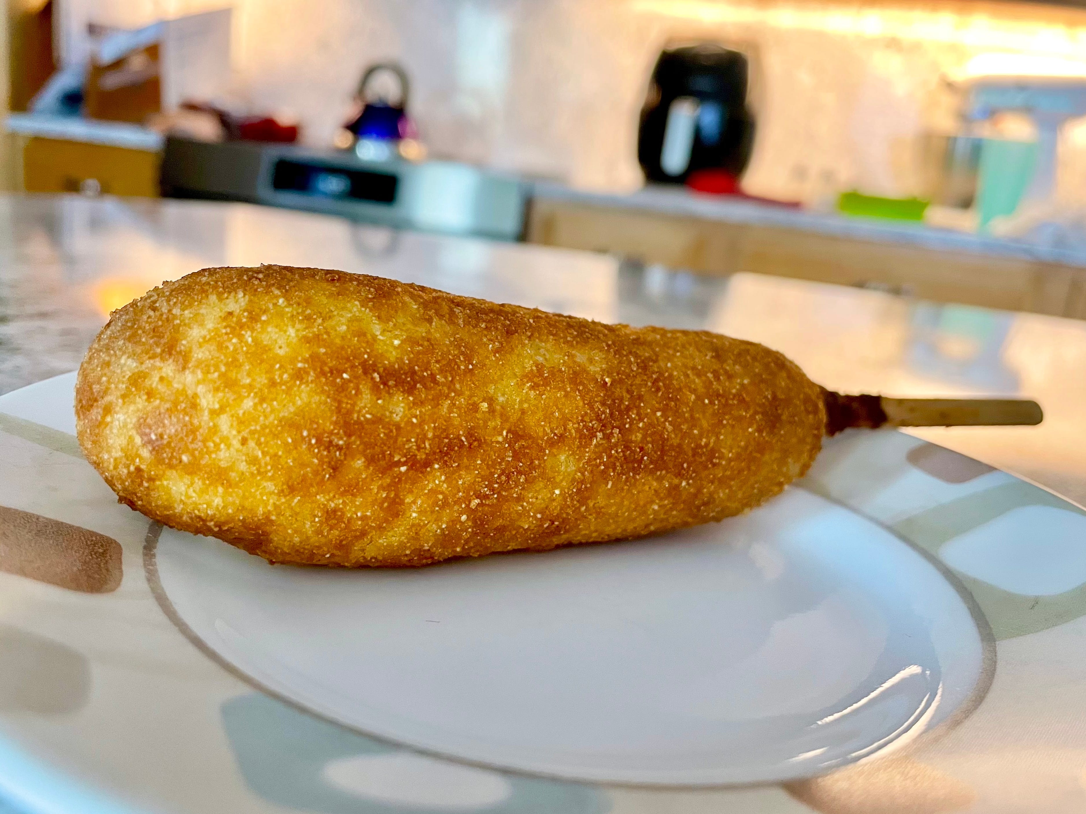 An Applegate Naturals corn dog on a plate.
