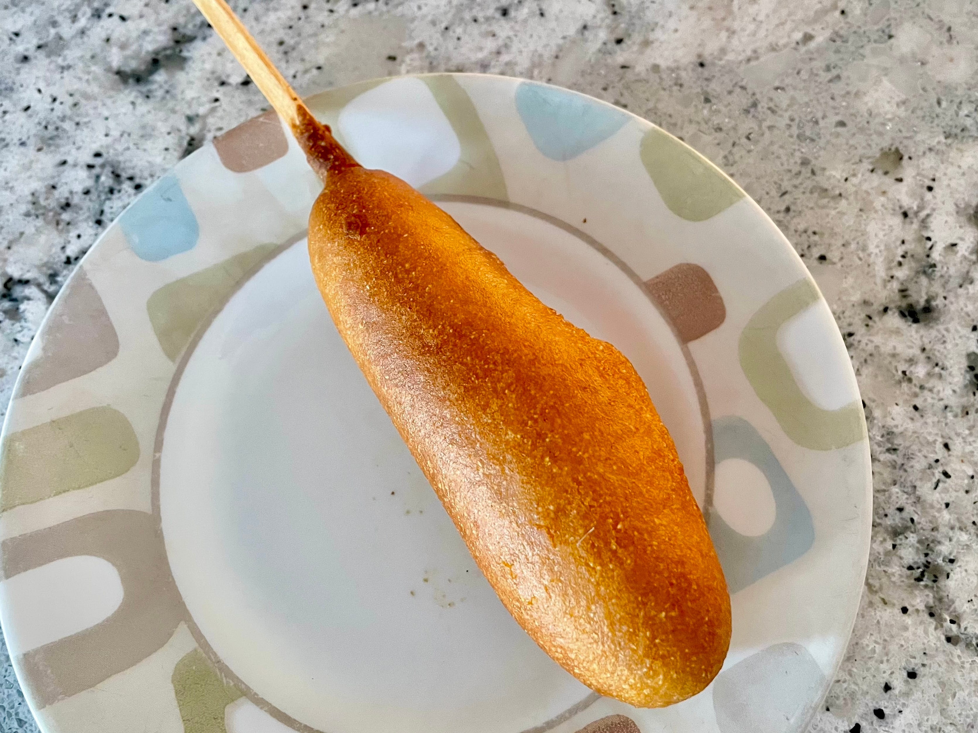 A Morningstar Farms corn dog on a plate.
