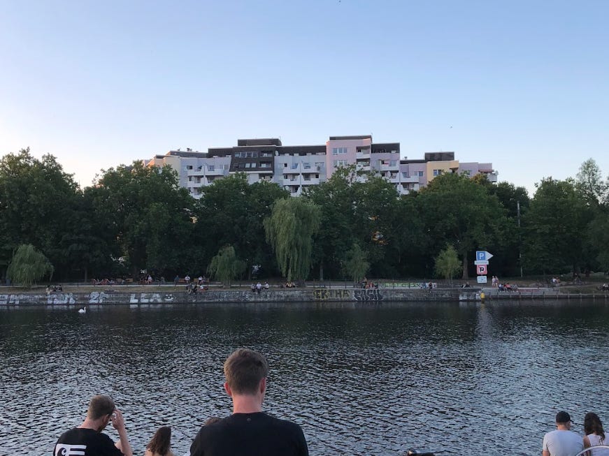 People sitting by the water in Berlin.
