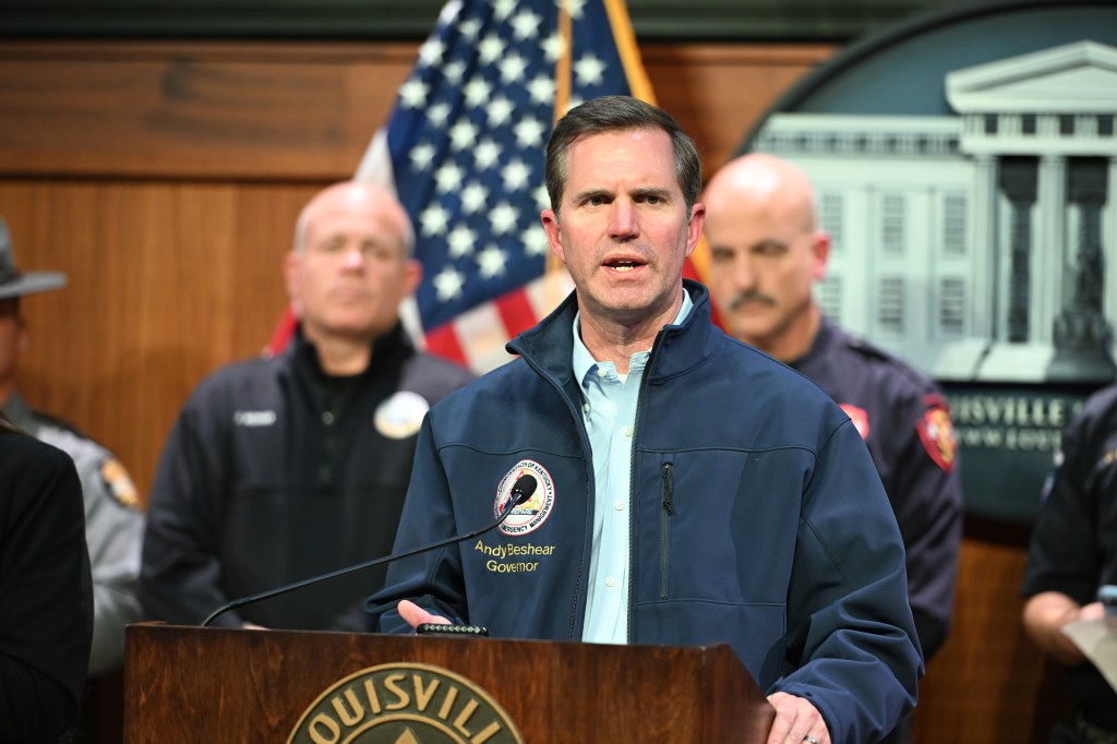Kentucky Gov. Andy Beshear speaking at a news conference about a UPS cargo plane crash.
