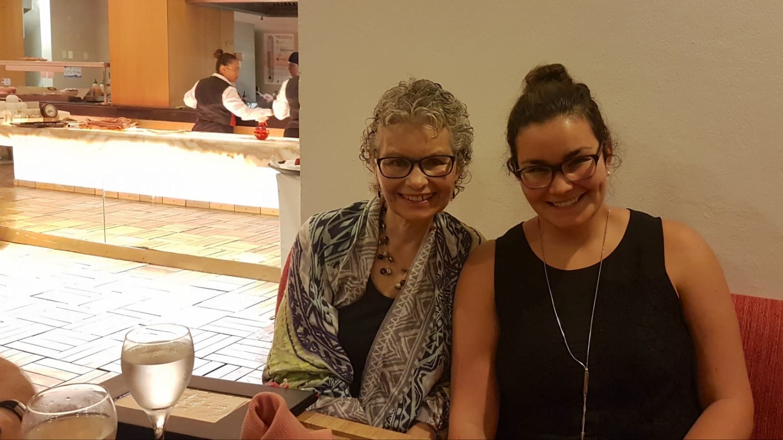 The author and her mom sit together at a restaurant in 2018.