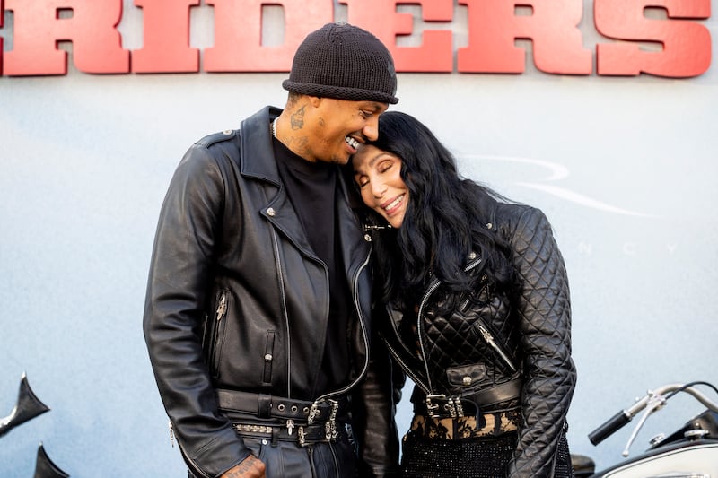 HOLLYWOOD, CALIFORNIA - JUNE 17: (L-R) Alexander Edwards and Cher attends the Los Angeles premiere of Focus Features 'The Bikeriders' at TCL Chinese Theatre on June 17, 2024 in Hollywood, California.