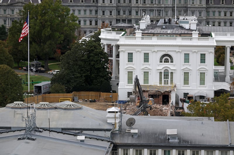 An excavator sits on the rubble after the East Wing of the White House was demolished on October 28, 2025.