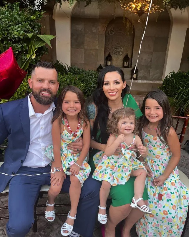 Christopher Scholtes with his family, including his daughter Parker, who died in a hot car.