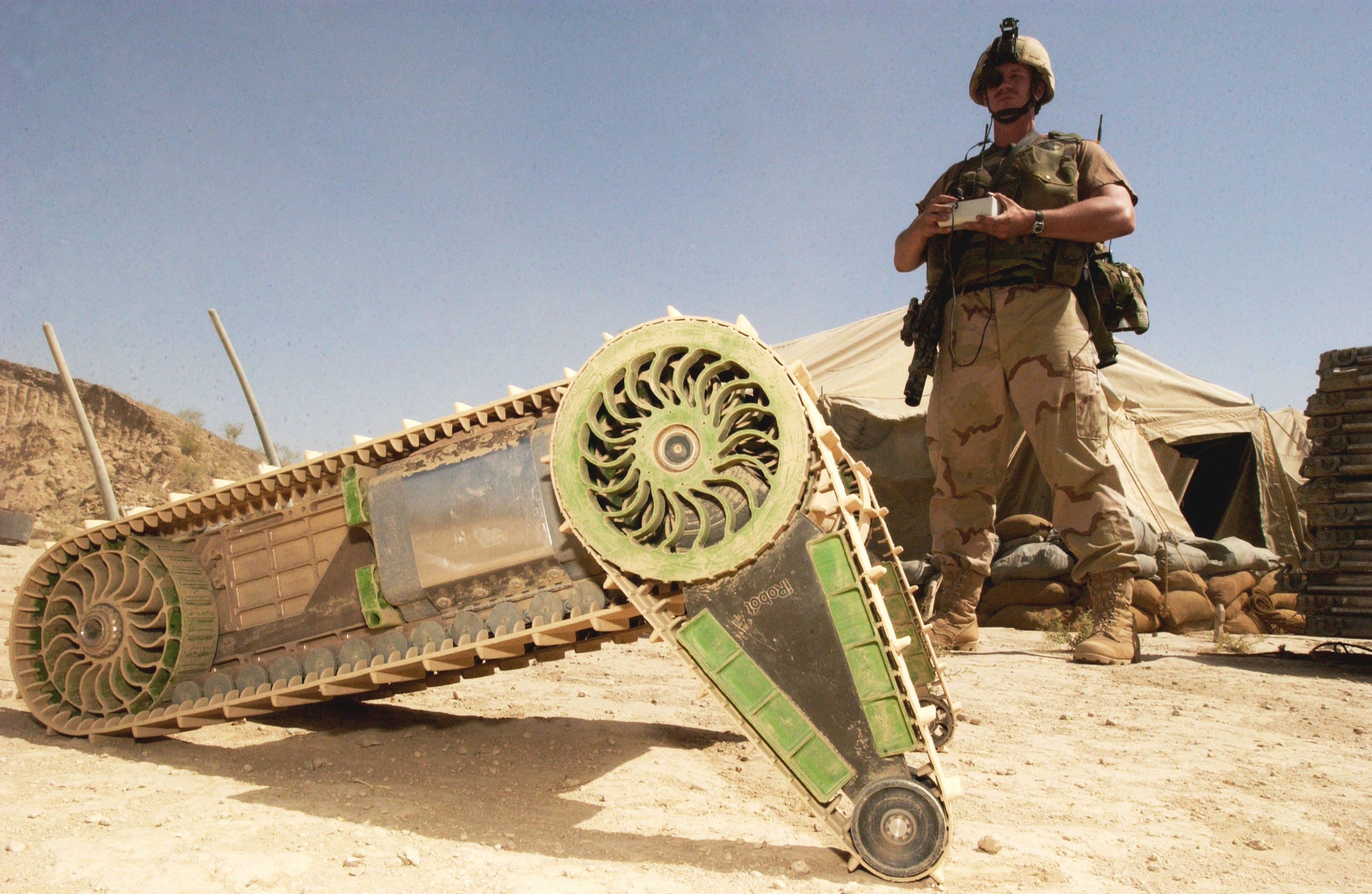 A soldier with an iRobot robot.