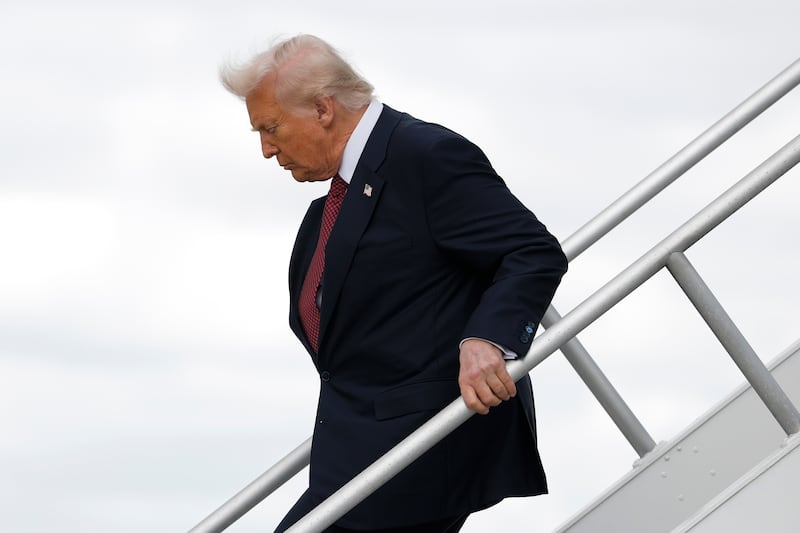 President Donald Trump arrives at Miami International Airport to attend the America Business Forum on November 05, 2025 in Miami, Florida.