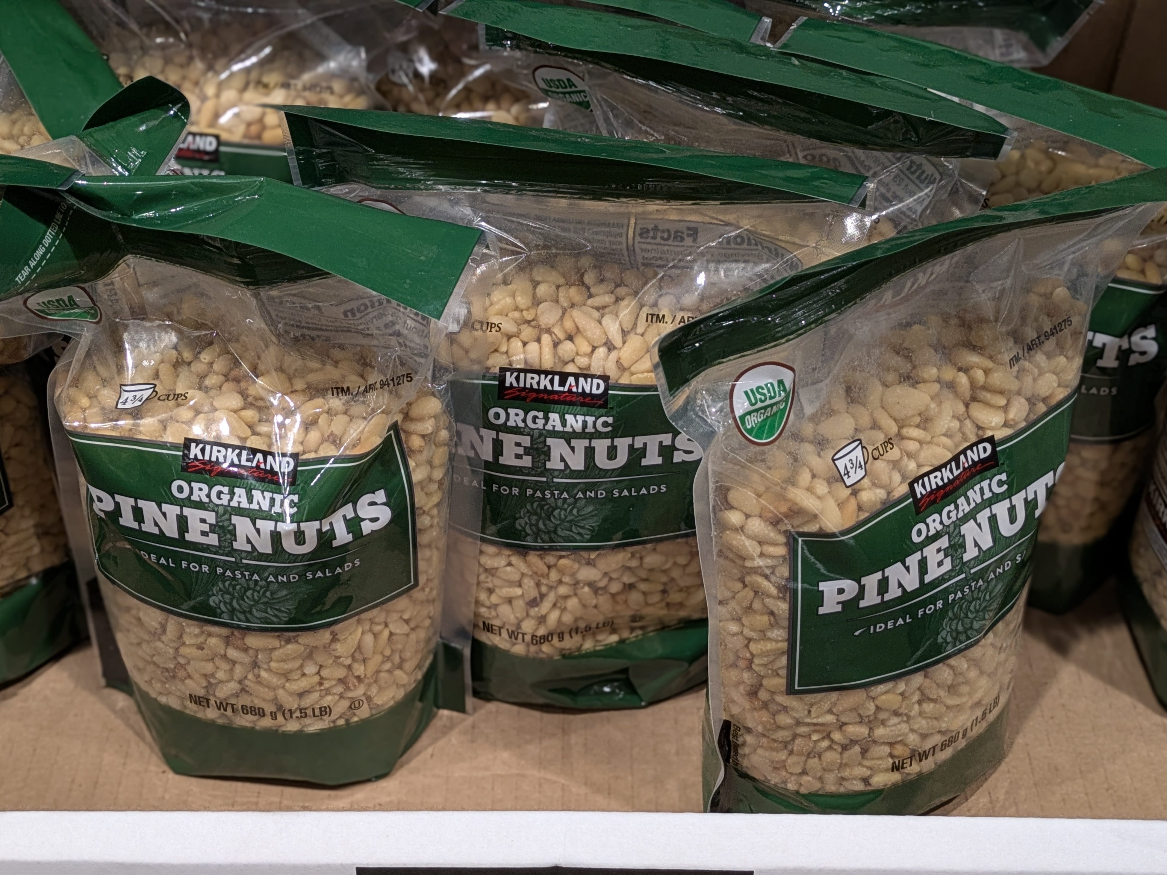 Bags of Kirkland Signature organic pine nuts.