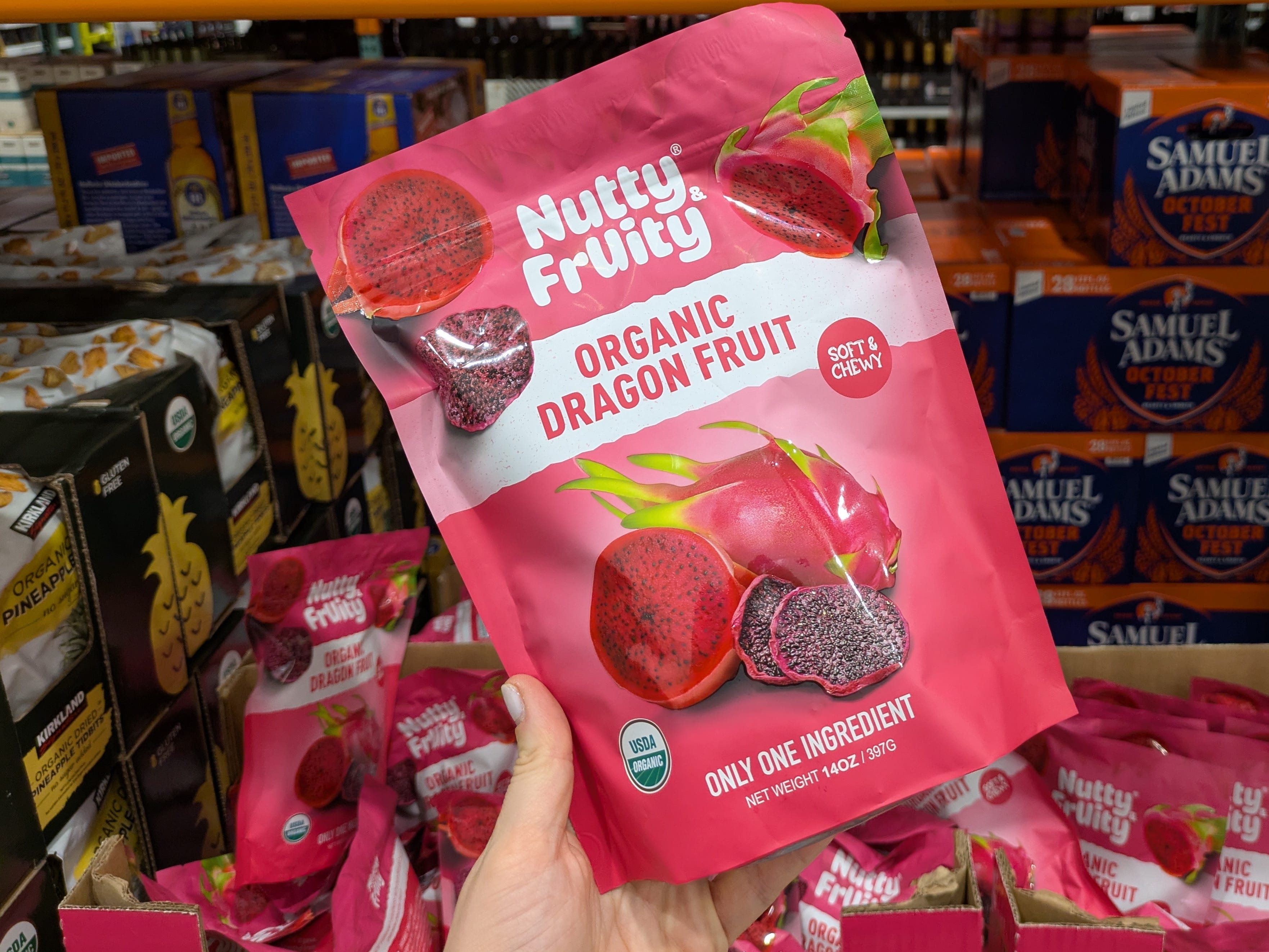 The author holding a bag of organic dragon fruit.