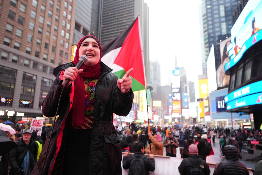 Linda Sarsour speaking to protesters in Times Square against the detention of Mahmoud Khalil.