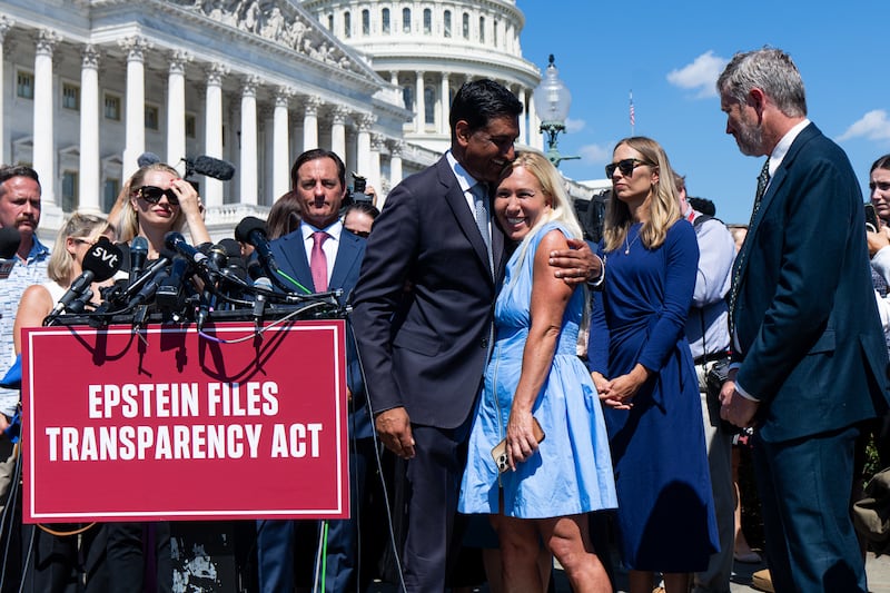 Rep. Marjorie Taylore Greene receives a hug from Democratic Rep. Ro Khanna as she joined him and Rep. Thomas Massie at a news conference with Epstein survivors. Greene was one of the few GOP members to reject Republican House leadership and sign the discharge petition to release the files on the convicted sex-offender.