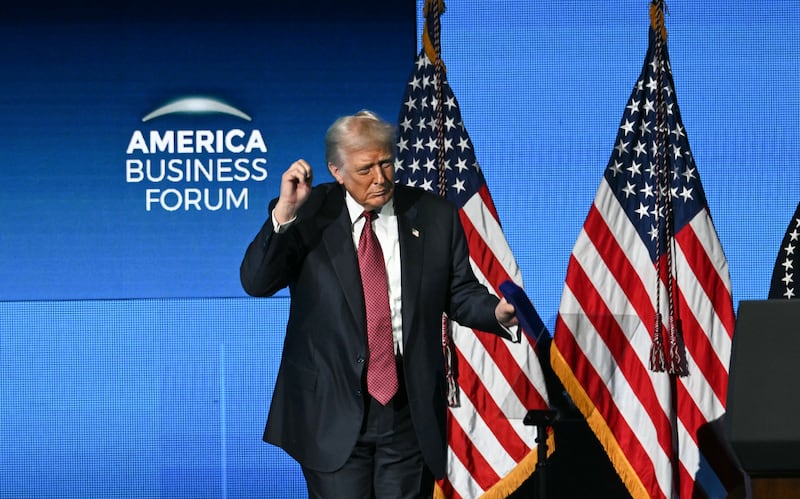 Donald Trump dances on stage after speaking at the American Business Forum at the Kaseya Center in Miami on November 5, 2025.