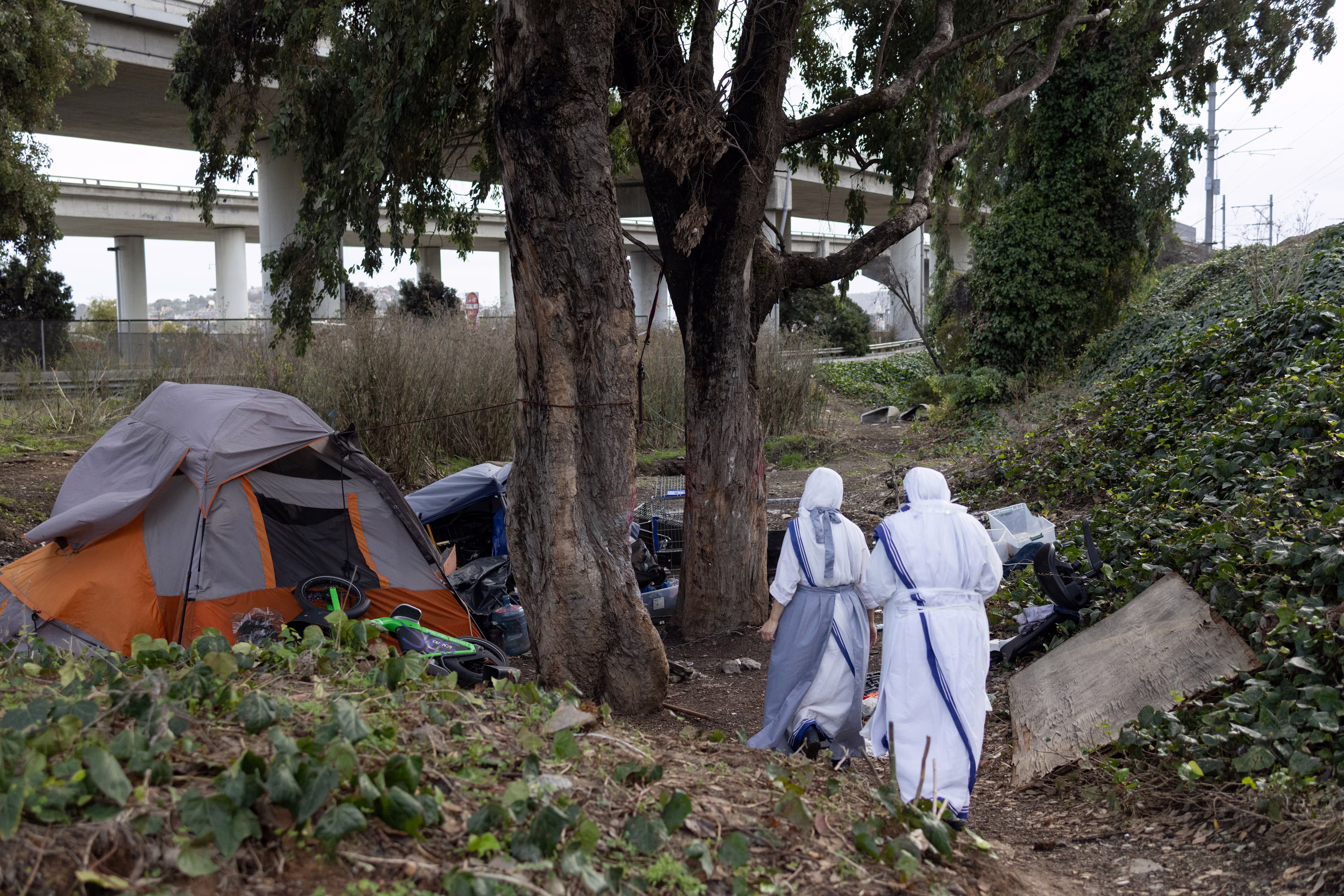 Picture of Sister Salvina walking alongside Sister Immaculate near the 280 North overpass in San Francisco, California.