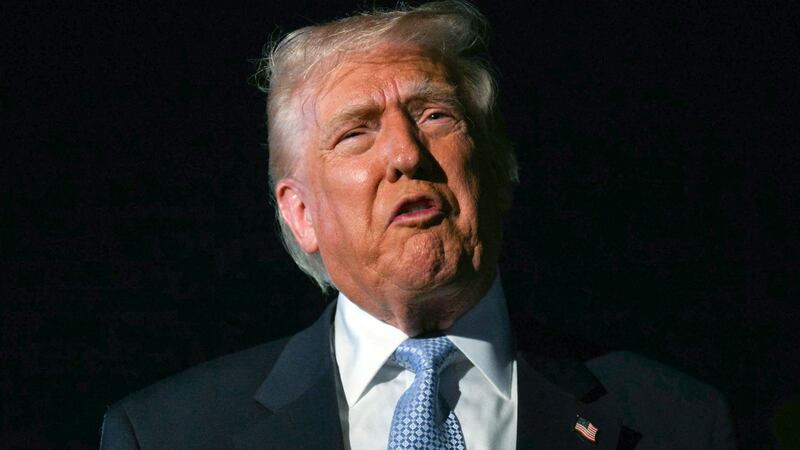 US President Donald Trump speaks with reporters before boarding Air Force One as he departs Palm Beach International Airport in West Palm Beach, Florida, on November 16, 2025.