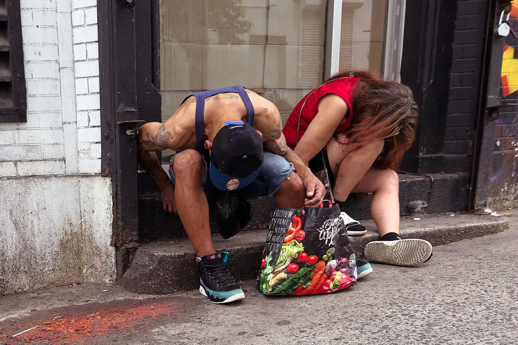 People seen using drugs in broad daylight in the Hub on July 19, 2025.