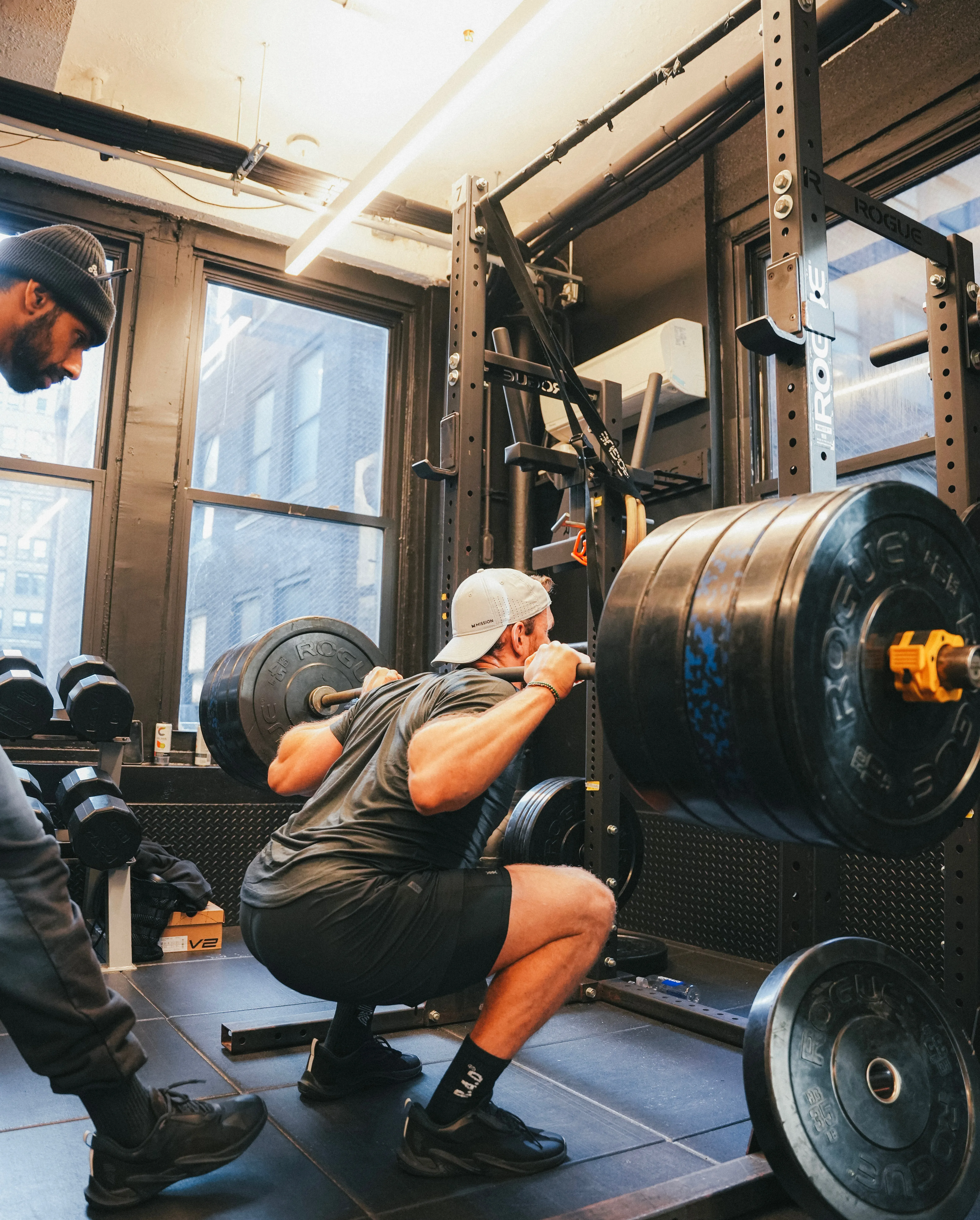 Man doing squats with heavy weights