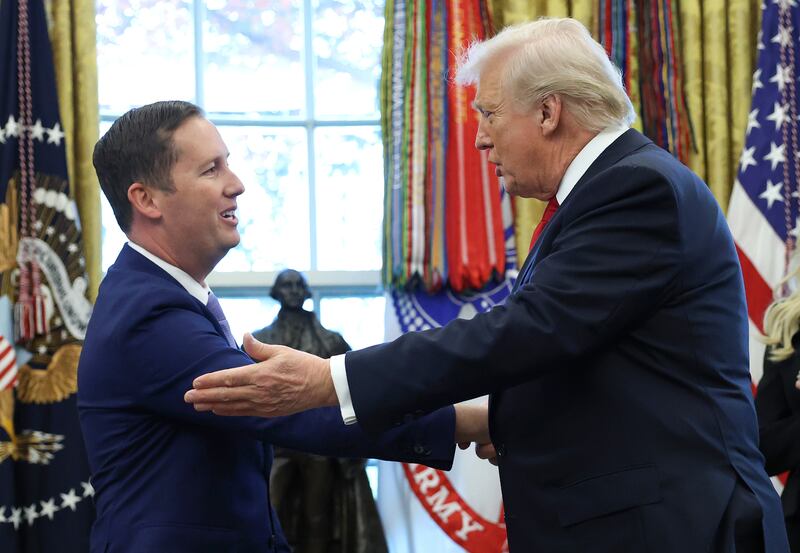 President Donald Trump shakes hands with U.S. Ambassador to India Sergio Gor, during his swearing-in ceremony in the Oval Office. (Photo by Anna Moneymaker/Getty Images)
