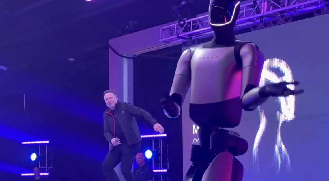 Elon Musk Does Weird Dance With Robot to Celebrate His $1 Trillion Tesla Deal