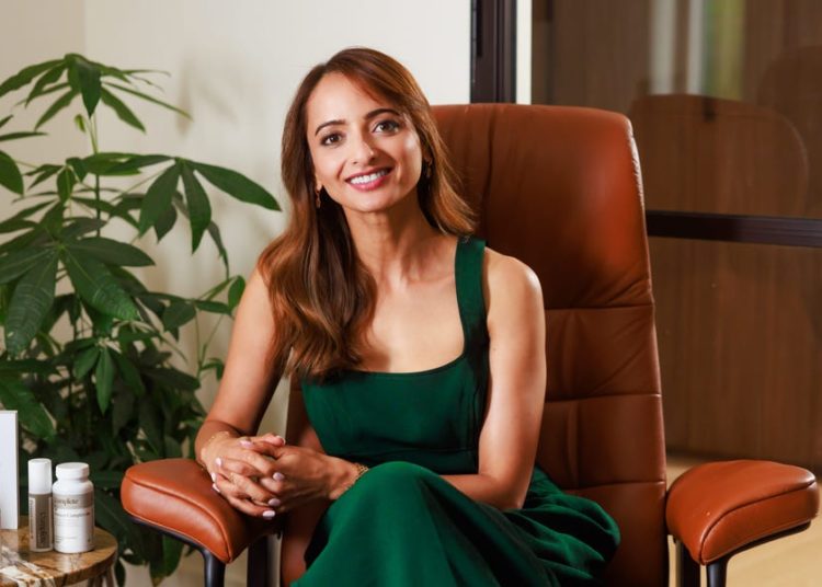 A 43-year-old pharmacist with a Ph.D. in topical skincare says she uses 4 products to keep her glow as she ages