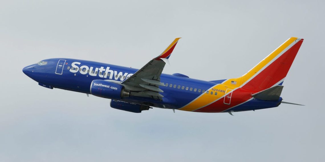 A Southwest plane had to abort its landing after a near miss with a helicopter crossing its path