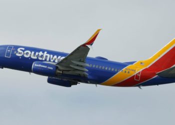 A Southwest plane had to abort its landing after a near miss with a helicopter crossing its path