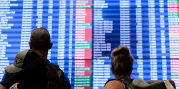 Mass delays and stranded travelers: Photos capture airport chaos amid the longest government shutdown in US history