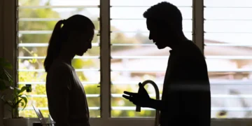 My husband and I planned to sell our starter home to buy land. Now I want to stay, and he feels betrayed — what do we do?