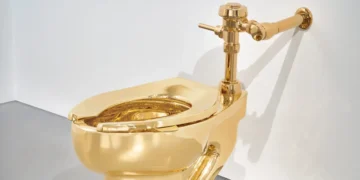 The artist behind the viral $6.2 million duct-taped banana also made a gold toilet — and it just sold for $12.1 million