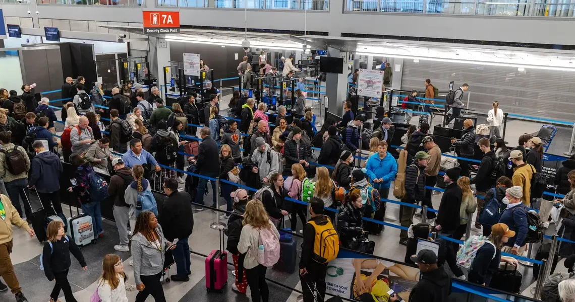 Hundreds of flights have been canceled after a snowstorm struck on one of the busiest travel weekends of the year
