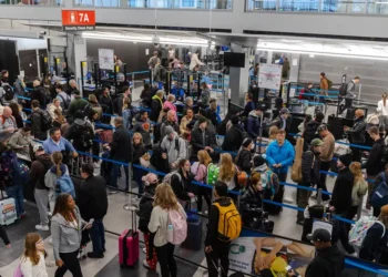 Hundreds of flights have been canceled after a snowstorm struck on one of the busiest travel weekends of the year
