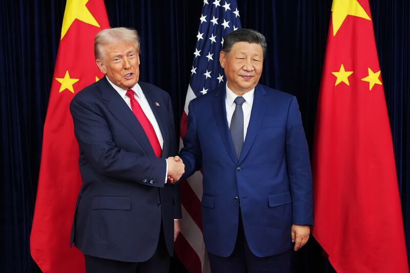 U.S. President Donald Trump greets Chinese President Xi Jinping