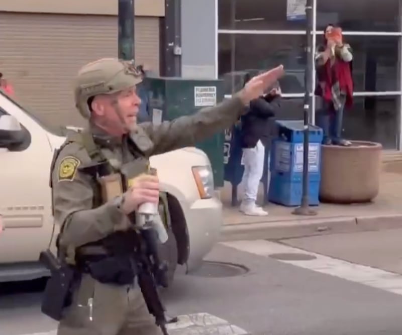 Gregory Bovino signals to protesters during the clash in Cicero, Illinois, on November 8, 2025.