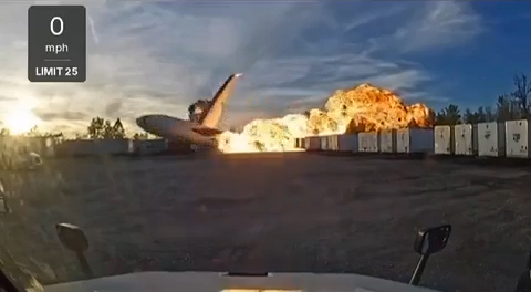 A private jet engulfed in flames after crashing.