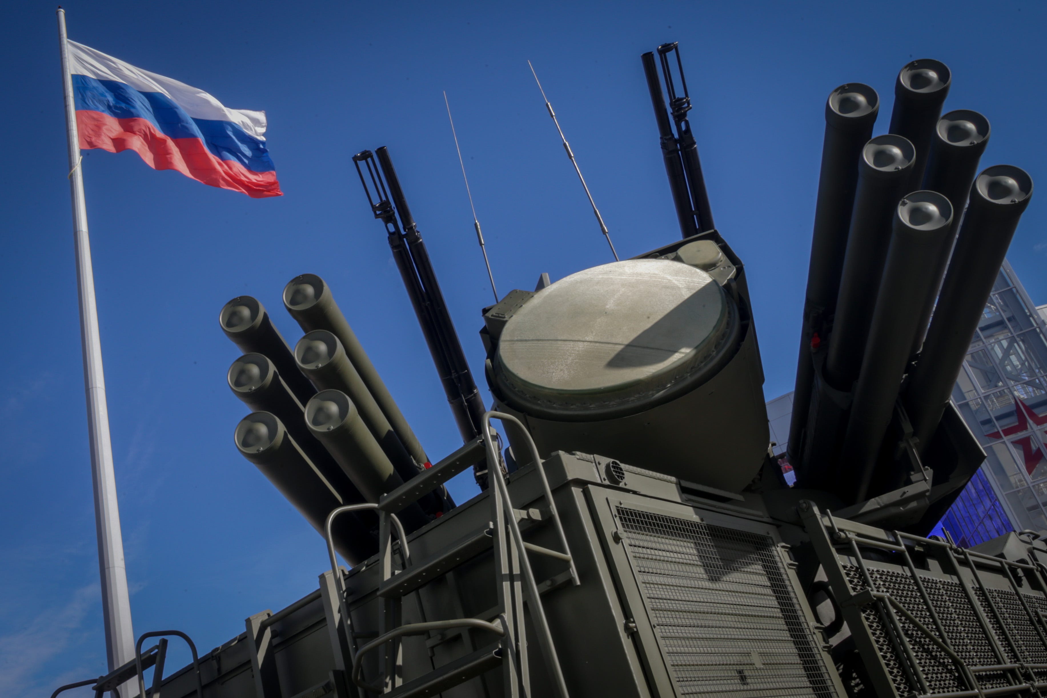 The Pantsir-S1 (SA-22), a self-propelled, medium-range surface-to-air missile system, is seen displayed under the Russian national flag during the annual Army defense technology exhibition.
