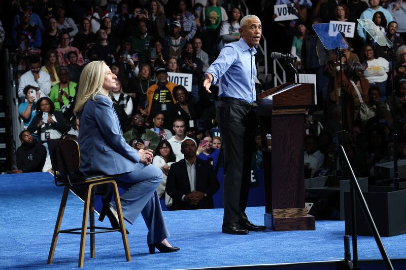 NORFOLK, VIRGINIA - NOVEMBER 01: Former U.S. President Barack Obama (R) speaks while campaigning for Virginia Democratic gubernatorial candidate, former Rep. Abigail Spanberger (L) during a campaign rally in the Chartway Arena on November 01, 2025 in Norfolk, Virginia. Spanberger will face off against Republican candidate Winsome Earle-Sears in the Commonwealth of Virginia’s off-year election for governor and other statewide offices on November 4. (Photo by Win McNamee/Getty Images)