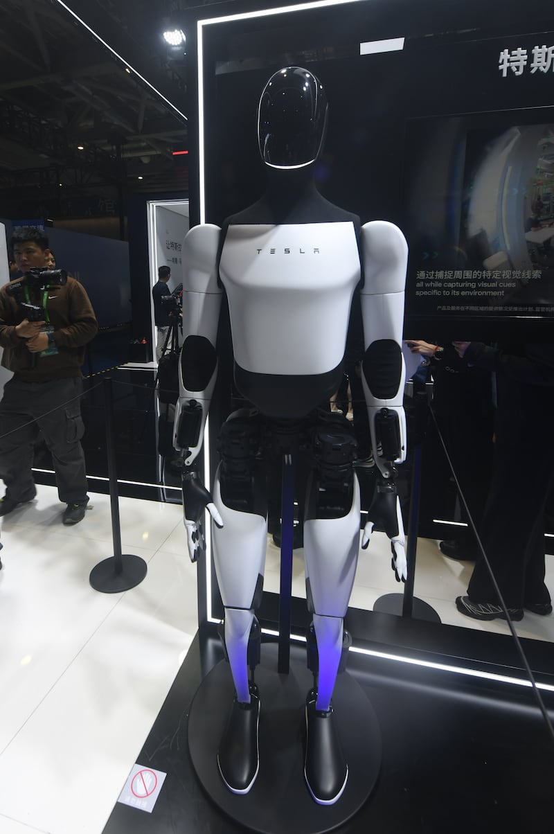 A Tesla Bot is showcased at the Tesla booth at the 8th CIIE in Shanghai, China, on November 6, 2025