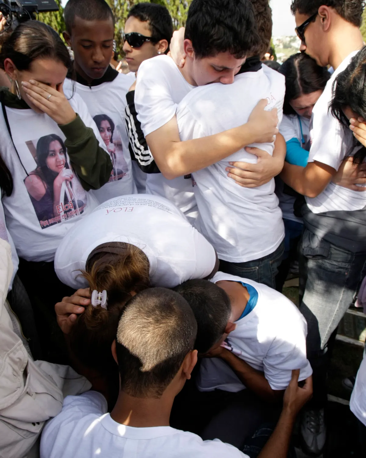 Teenagers react during the funeral of Pimentel in Santo Andre