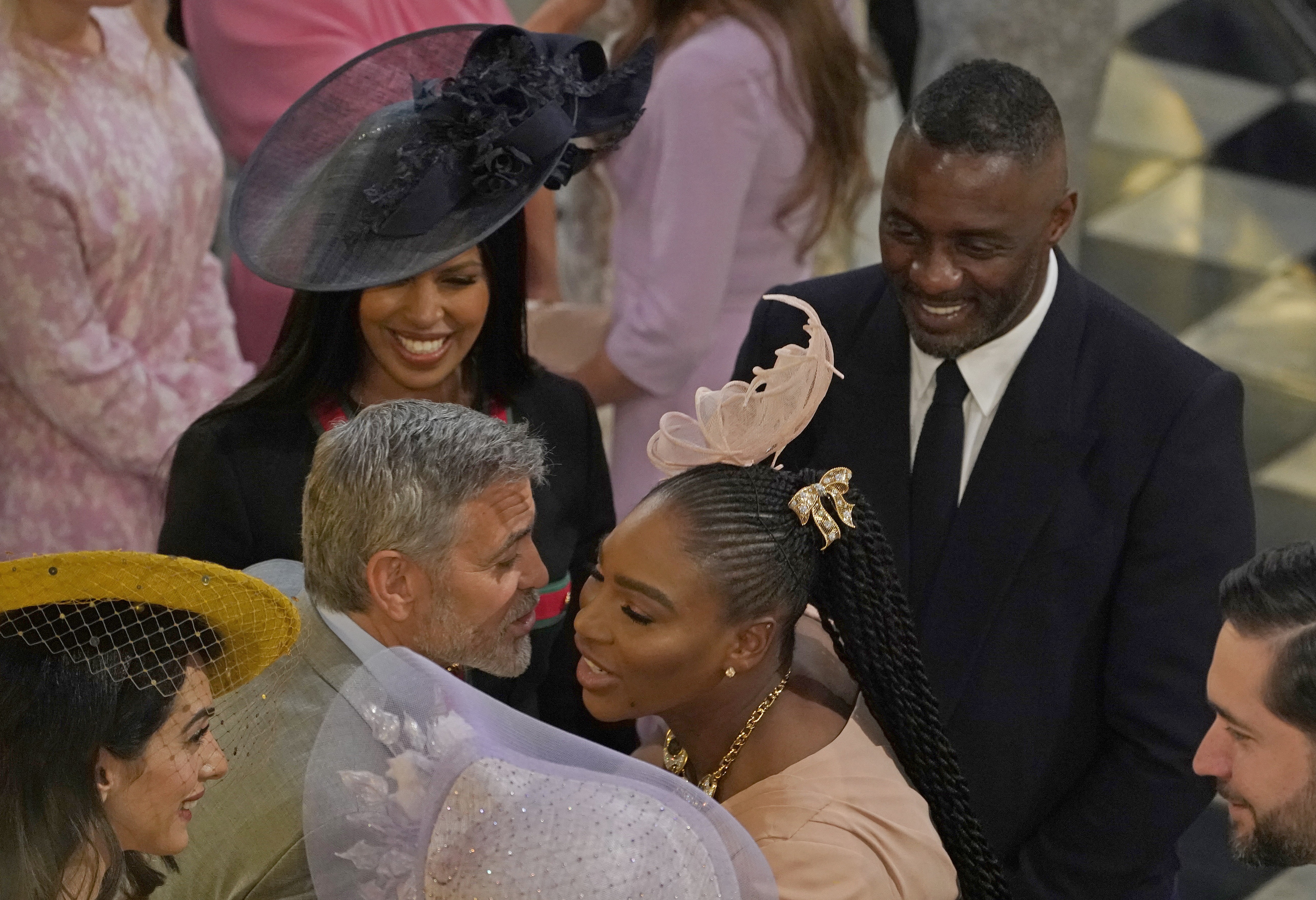 WINDSOR, ENGLAND - MAY 19: George Clooney greets Serena Williams as Idris Elba and Sabrina Dhowre look on at St George's Chapel on May 19, 2018 in Windsor, England. (Photo by Owen Humphreys - WPA Pool/Getty Images)