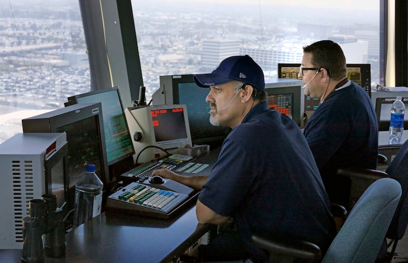 LOS ANGELES, CA - June 24: At Los Angeles International Airport FAA officials gave a media tour for a new communications system between air traffic controllers and pilots. Data Comm as it is called, is a texting system that replaces some voice radio communications that is prone to errors. It is expected to shave minutes off flights, cut down on travel delays and be more accurate.    (Photo by Brad Graverson/MediaNews Group/Torrance Daily Breeze via Getty Images)
