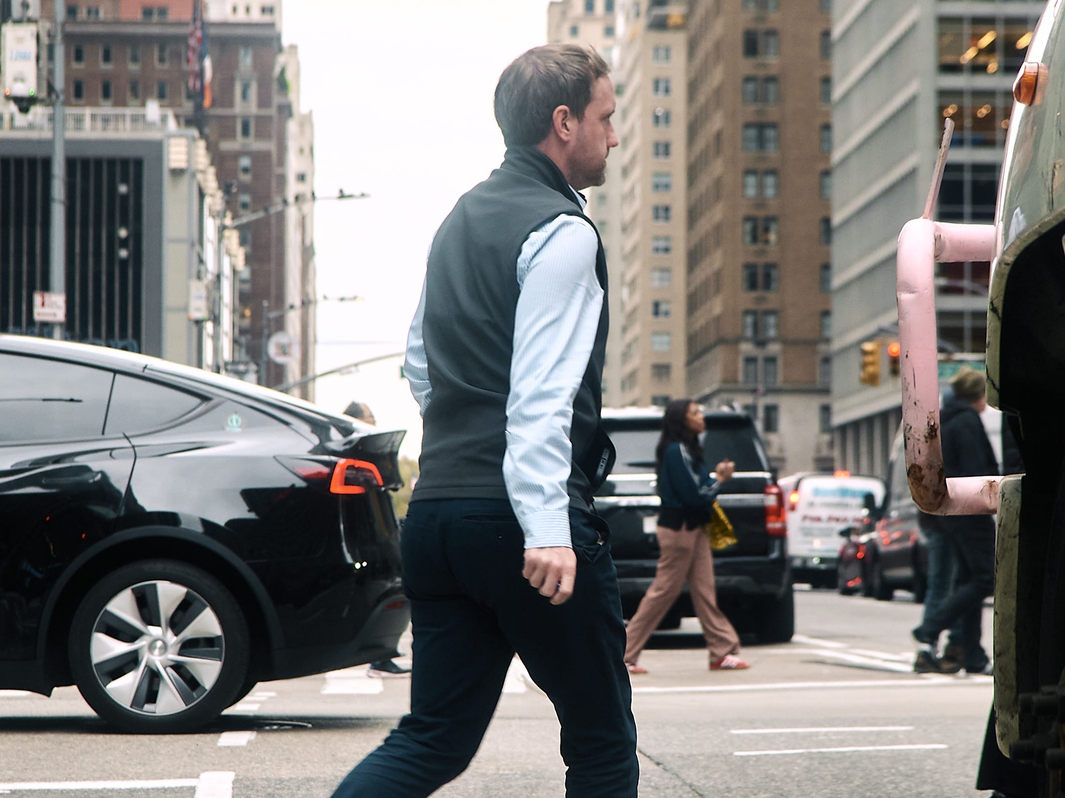 A man wearing a finance vest