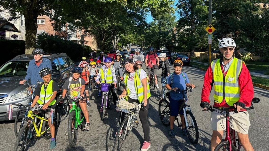 From a few to more than 350, children and parents ride together to school as a ‘bike bus’
