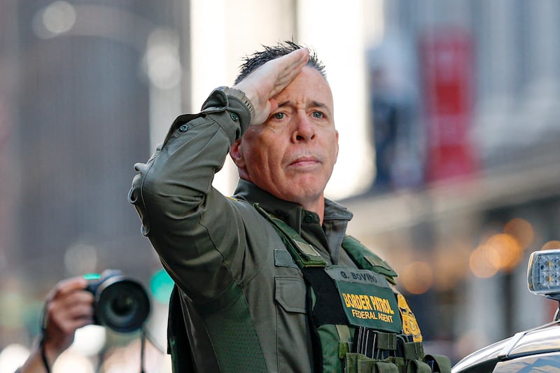 US Customs and Border Patrol Commander Gregory Bovino (C) leaves federal court at Dirksen Federal Building after his hearing in Chicago, Illinois, on October 28, 2025. Bovino was ordered to appear in federal court for violating a temporary restraining order issued by District Judge Sara Ellis that orders immigration enforcement agents to limit use of tear gas and other crowd-suppression items except when there is an imminent threat. (Photo by KAMIL KRZACZYNSKI / AFP) (Photo by KAMIL KRZACZYNSKI/AFP via Getty Images)