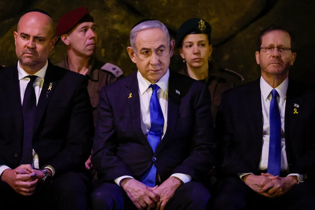 Benjamin Netanyahu sits next to Isaac Herzog during a Holocaust Remembrance Day ceremony in Jerusalem on May 6, 2024.