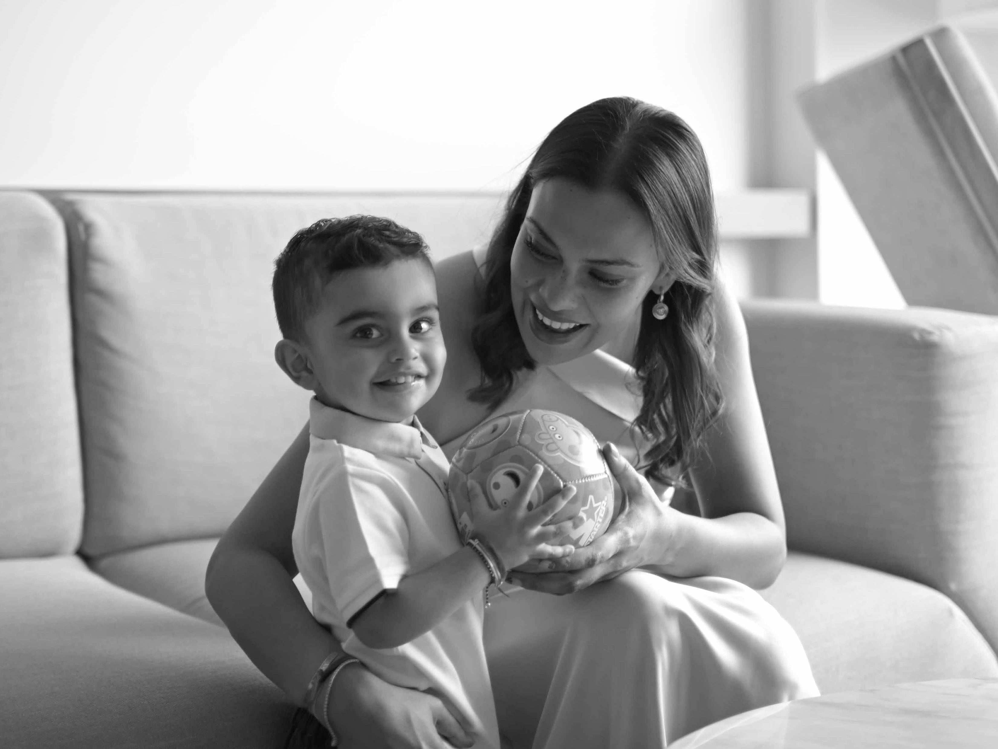 Mom and her son hold a ball