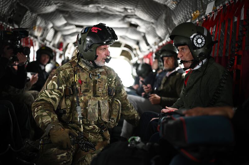 WARMINSTER, ENGLAND - JUNE 3: Defence Secretary John Healey speaks with flight crew as he visits Warminster Garrison on June 3, 2025 in Warminster, United Kingdom. As part of the Strategic Defence Review, John Healy announces that drone manufacturing in the UK will be enhanced by a £2 billion investment in autonomous and uncrewed drones, which will strengthen the Armed Forces' lethal battlefield capabilities. A further £1 billion is to be dedicated to the British laser-directed energy weapon DragonFire and the development of a new Drone Centre. (Photo by Leon Neal/Getty Images)