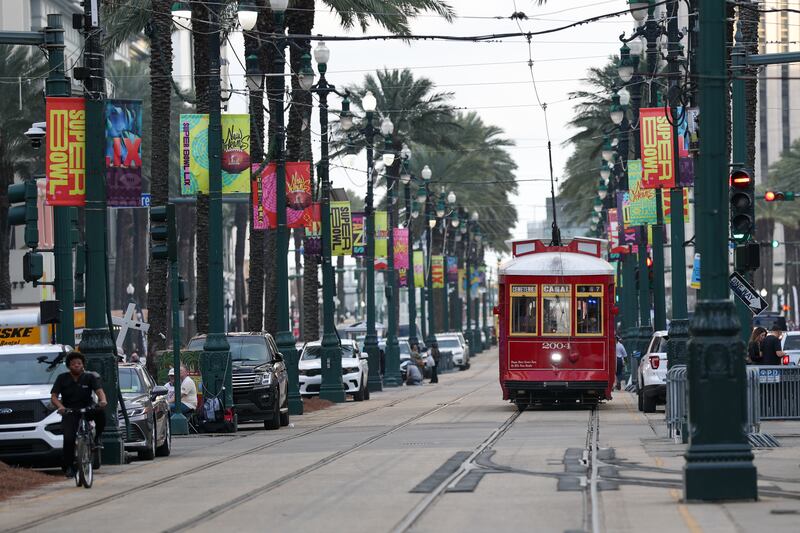 The Canal Streetcar passes by Super Bowl LIX signs