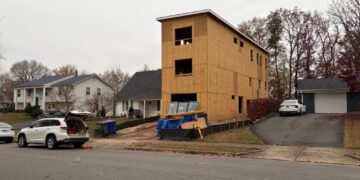 A hulking home addition is dividing neighbors and stumping officials