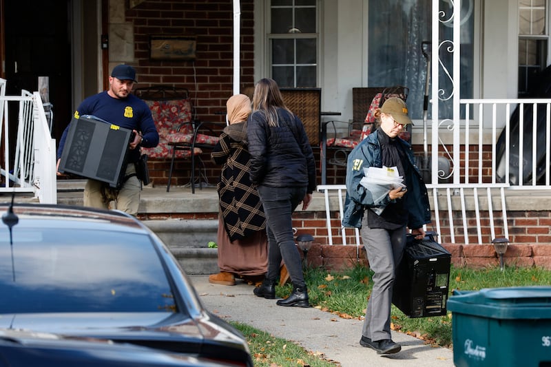 Members of the FBI remove items from a home in Dearborn, Michigan, on October 31, 2025.