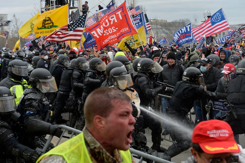 Trump supporters and police officers clashed at the Capitol on Jan. 6, 2021. Trump later pardoned those who attacked the Capitol.